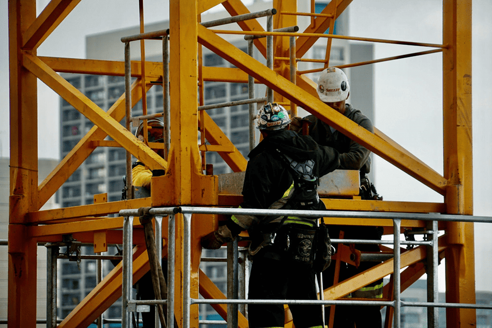 Man in a black jacket and safety hat