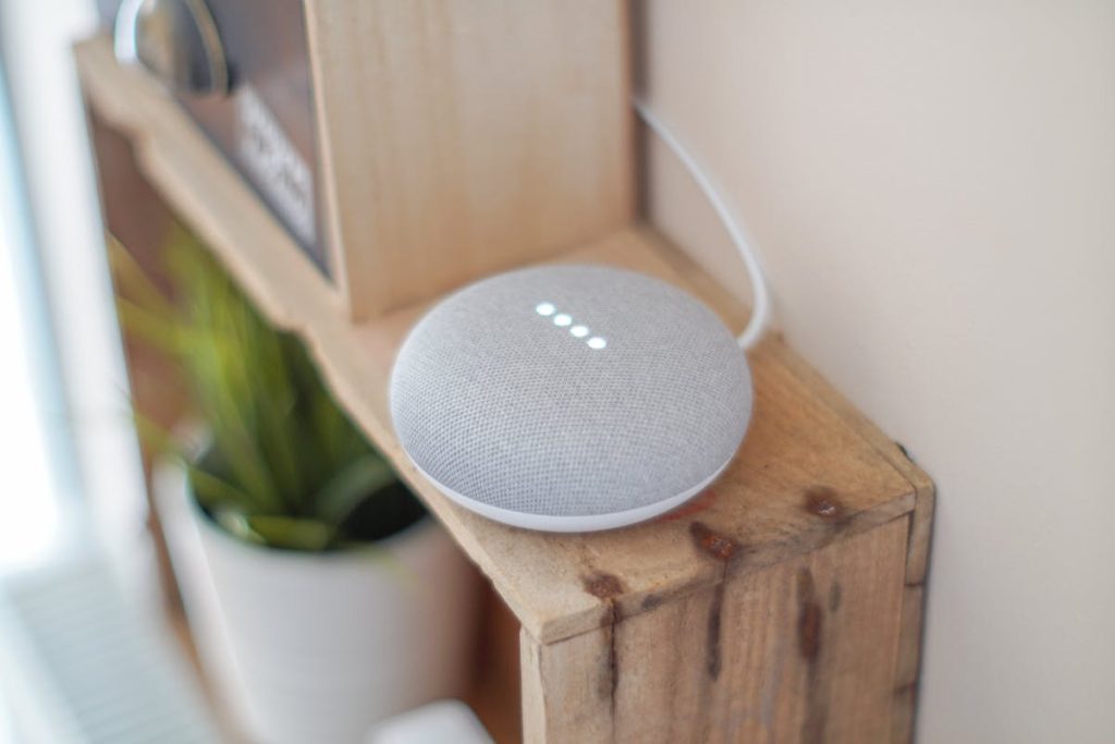grey speaker on brownboard